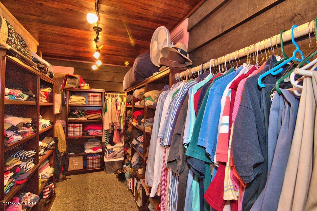 24 Summit Avenue Pocono Manor, PA 18349 - Photo 37 of 114 a view of walk in closet with clothes and shoes