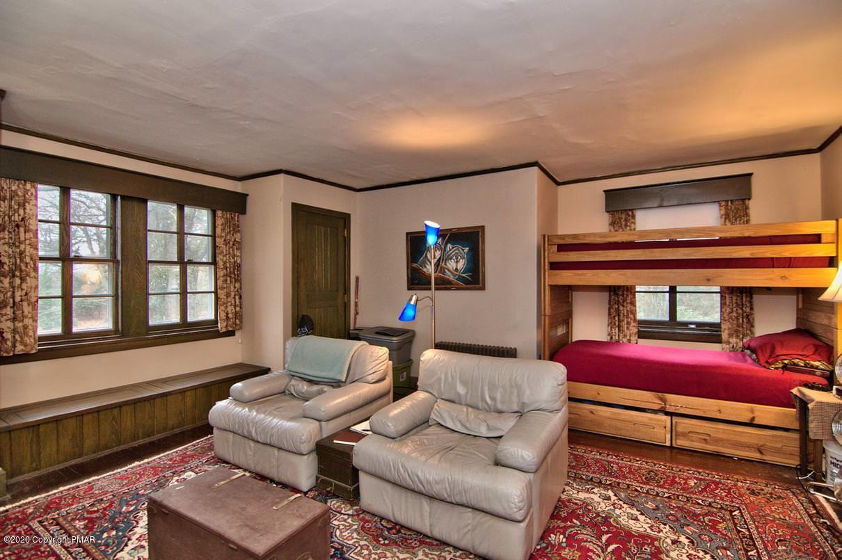 24 Summit Avenue Pocono Manor, PA 18349 - Photo 45 of 114 a bedroom with furniture and a large window