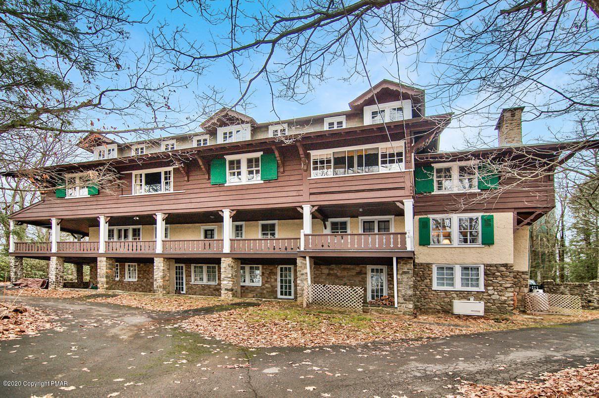 24 Summit Avenue Pocono Manor, PA 18349 - Photo 5 of 114 front view of a building with a street