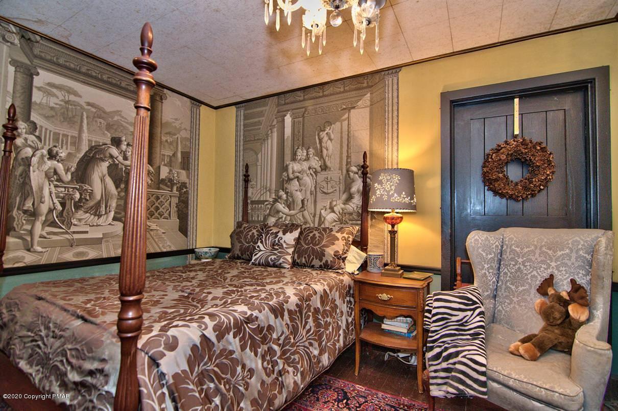 24 Summit Avenue Pocono Manor, PA 18349 - Photo 55 of 114 a bedroom with a bed and painting on the wall