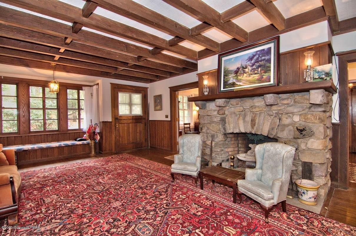 24 Summit Avenue Pocono Manor, PA 18349 - Photo 6 of 114 a living room with furniture and a fireplace