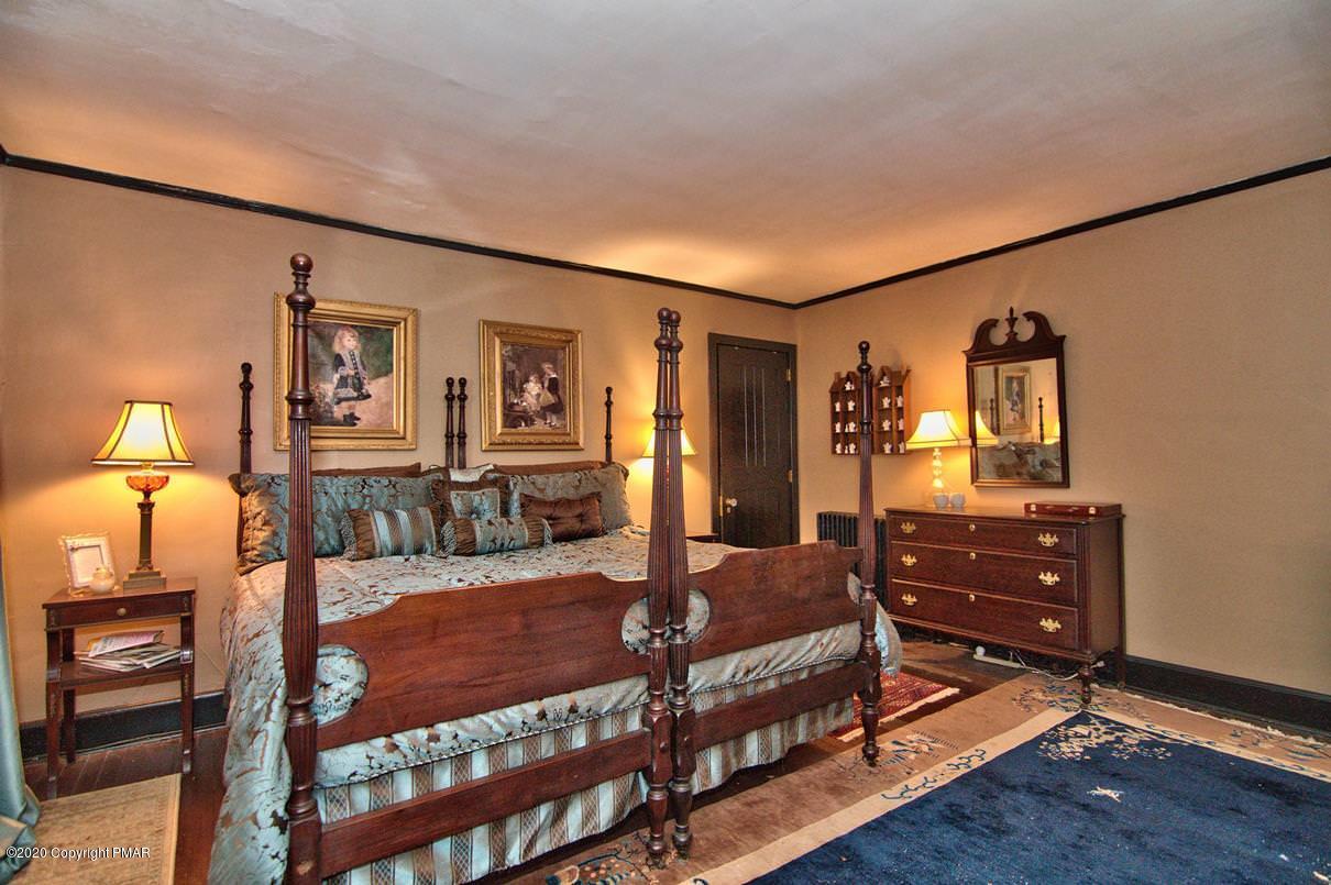 24 Summit Avenue Pocono Manor, PA 18349 - Photo 65 of 114 a bedroom with furniture and wooden floor