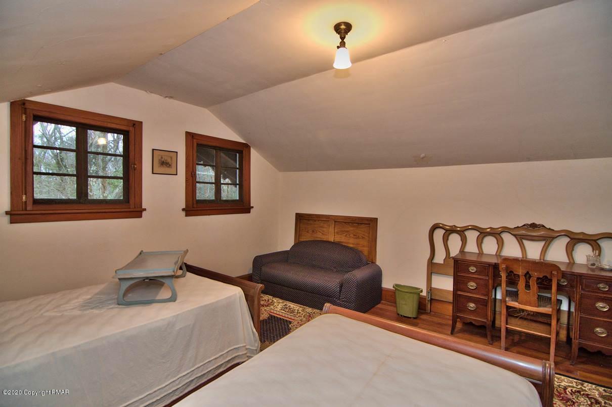 24 Summit Avenue Pocono Manor, PA 18349 - Photo 86 of 114 a bedroom with furniture and wooden floor