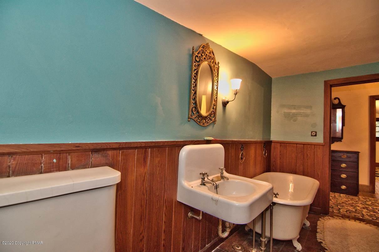 24 Summit Avenue Pocono Manor, PA 18349 - Photo 94 of 114 a bathroom with a sink a toilet and mirror