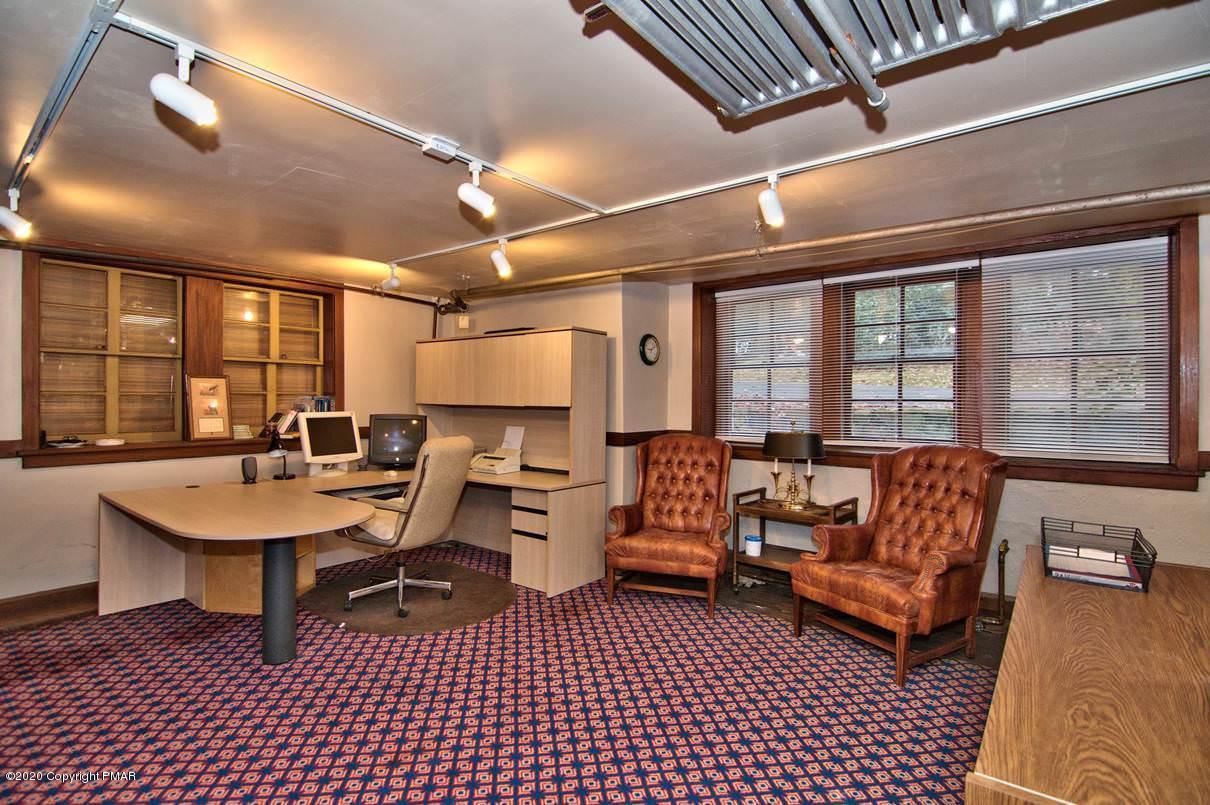 24 Summit Avenue Pocono Manor, PA 18349 - Photo 98 of 114 a living room with furniture a table and a large window