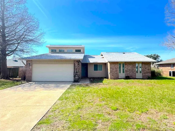 a view of a house with pool and yard