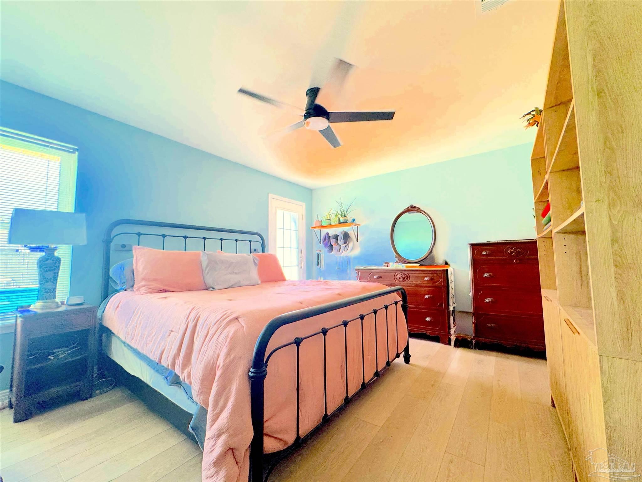 3585 Riddick Drive Pensacola, FL 32504 - Photo 11 of 22 a bedroom with a bed dresser and a window