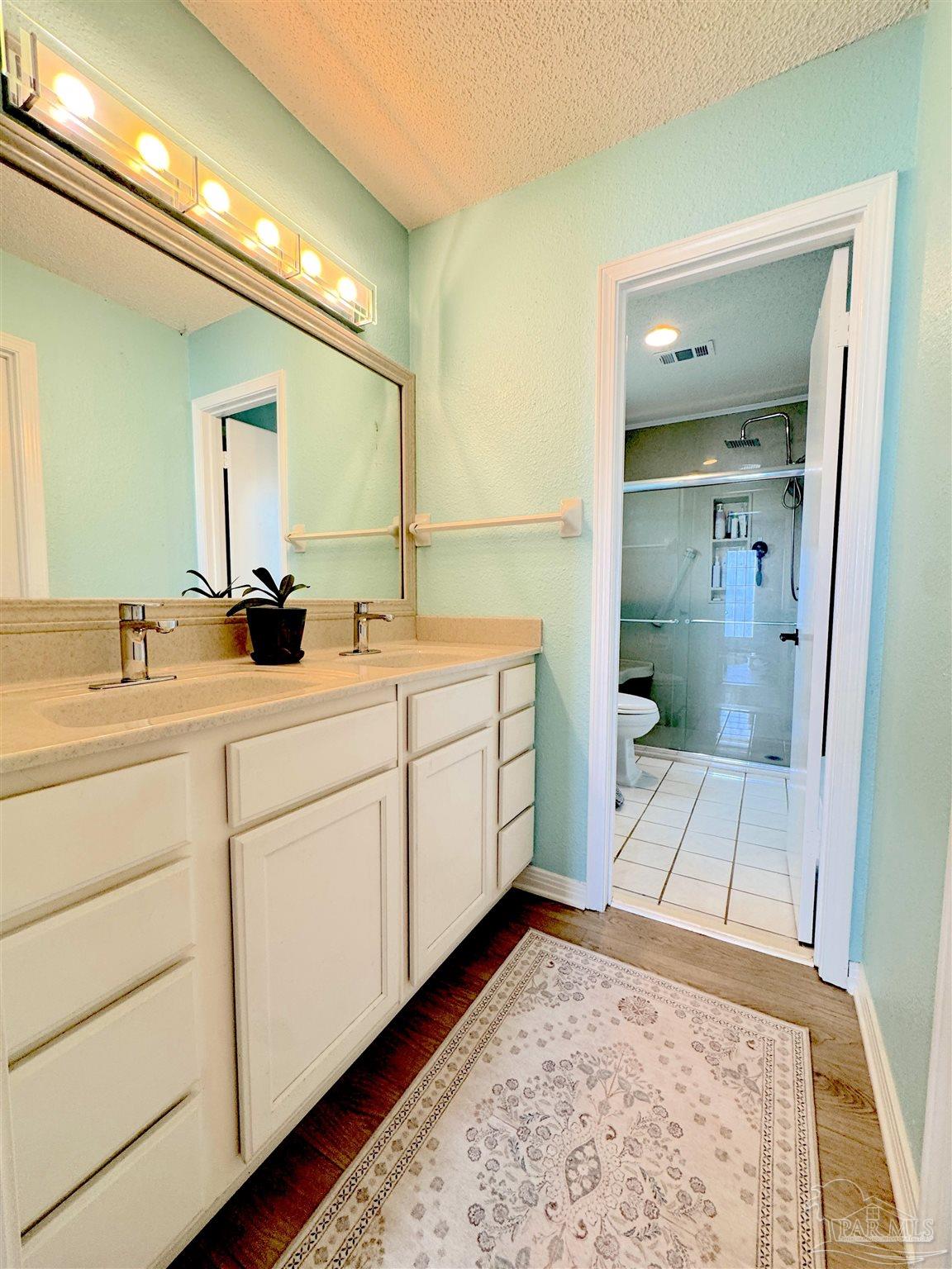 3585 Riddick Drive Pensacola, FL 32504 - Photo 13 of 22 a bathroom with a sink and a mirror