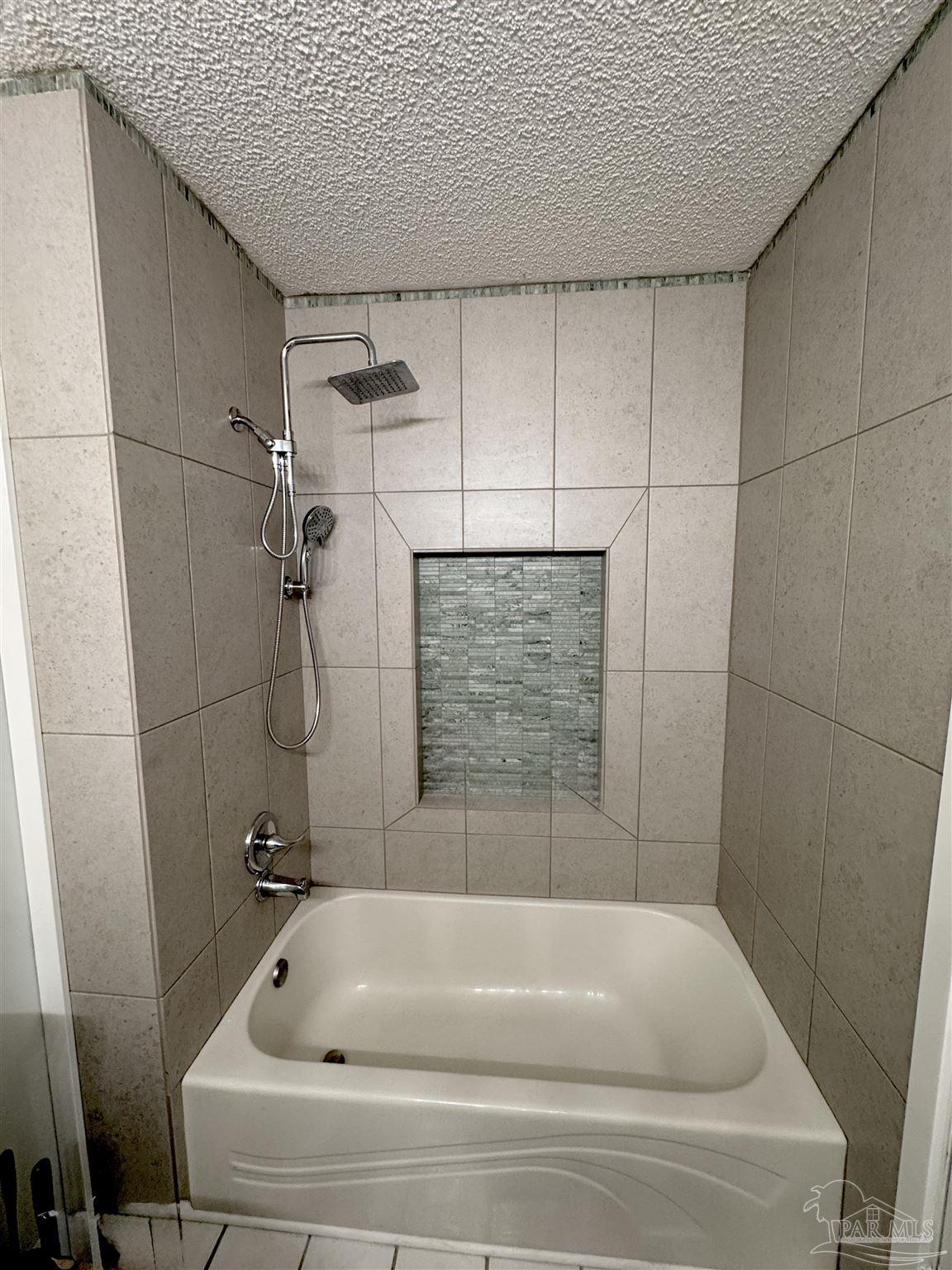 3585 Riddick Drive Pensacola, FL 32504 - Photo 14 of 22 a bathroom with a tub