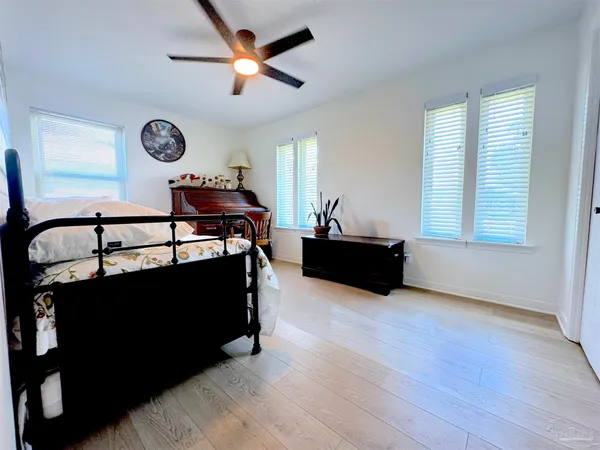 a living room with table chairs and a window