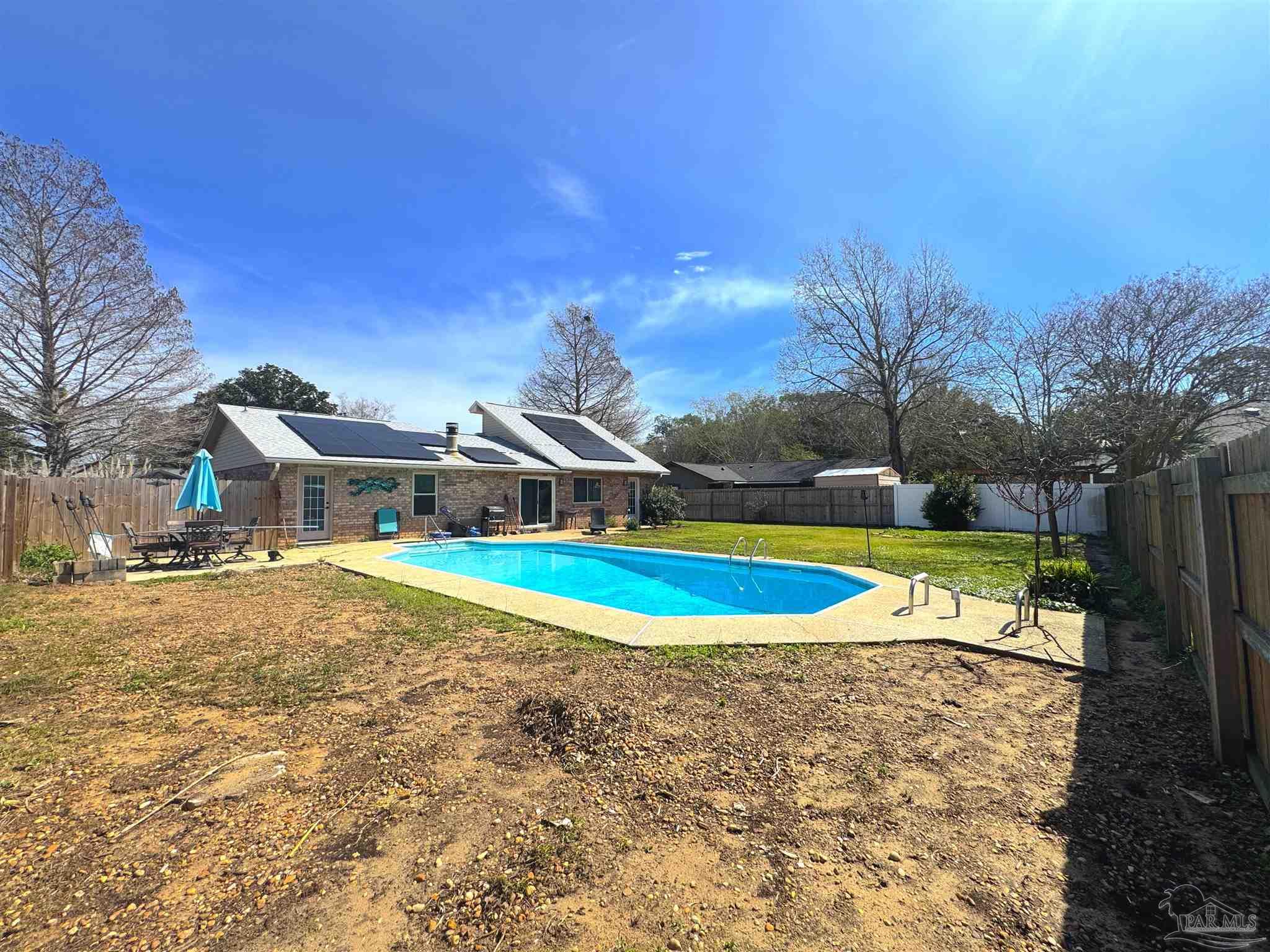 3585 Riddick Drive Pensacola, FL 32504 - Photo 20 of 22 a view of a swimming pool and a yard