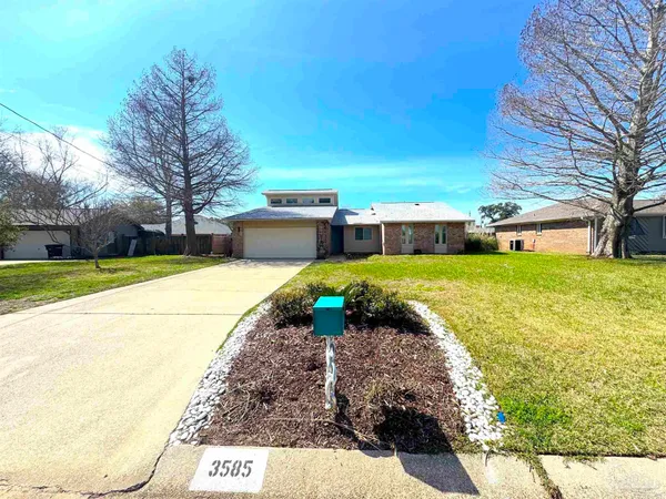 a view of a swimming pool with a yard