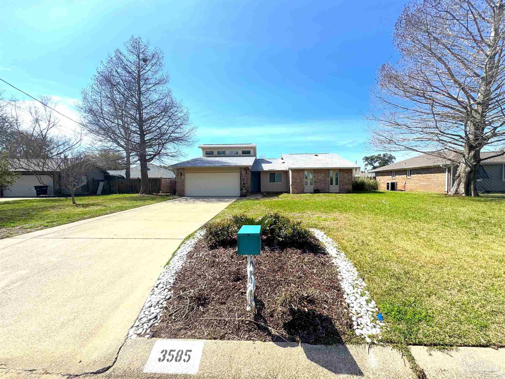 3585 Riddick Drive Pensacola, FL 32504 - Photo 2 of 22 a view of a swimming pool with a yard