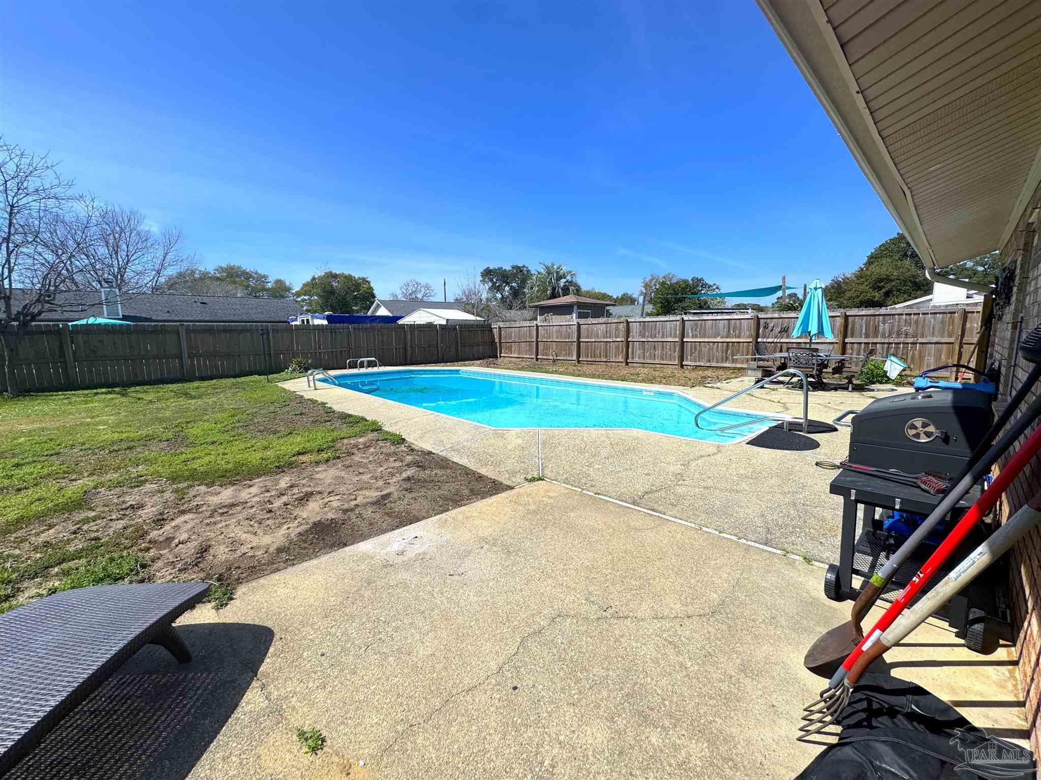 3585 Riddick Drive Pensacola, FL 32504 - Photo 21 of 22 a view of a backyard and swimming pool