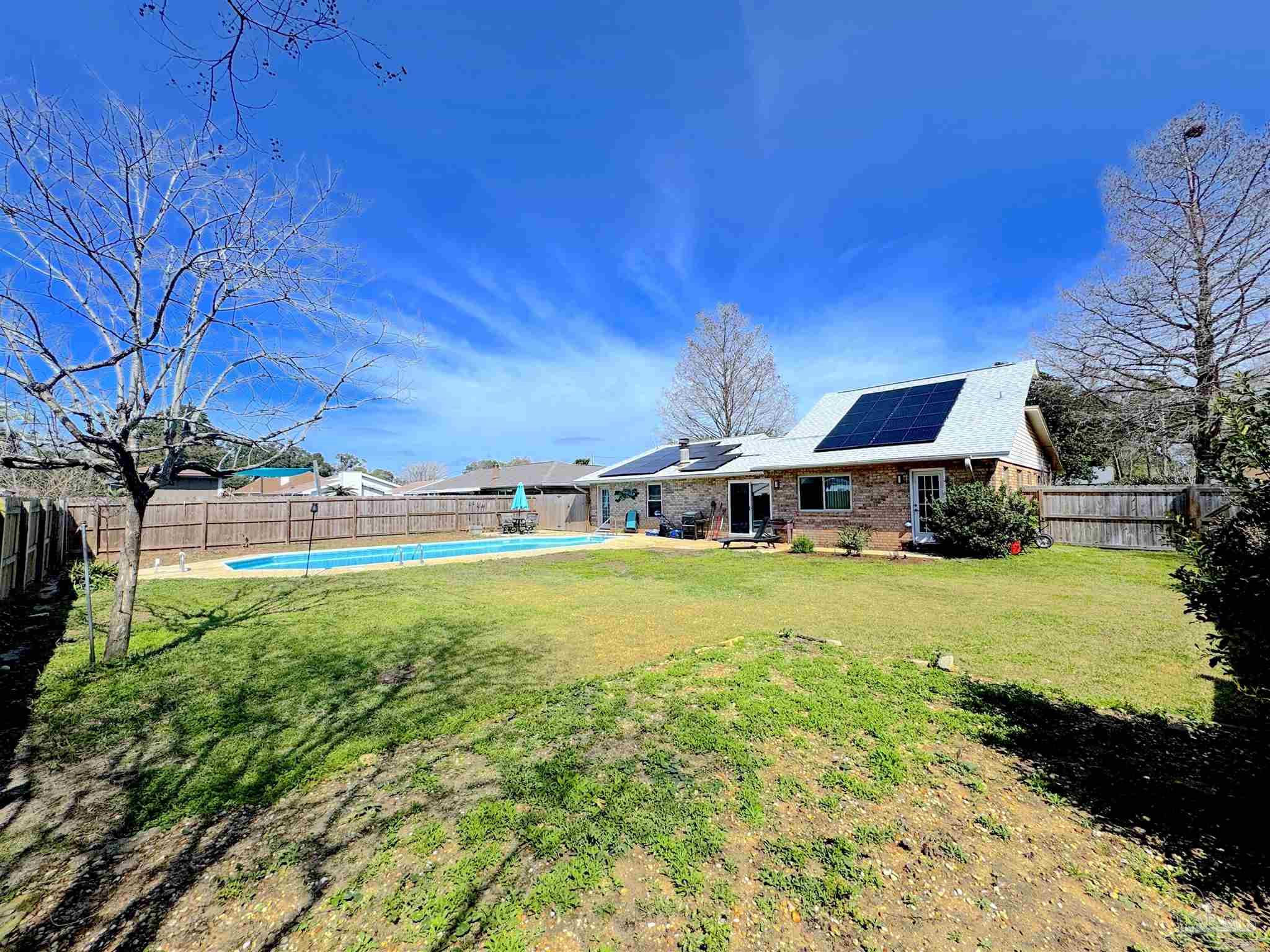 3585 Riddick Drive Pensacola, FL 32504 - Photo 22 of 22 a view of a house with pool and a yard