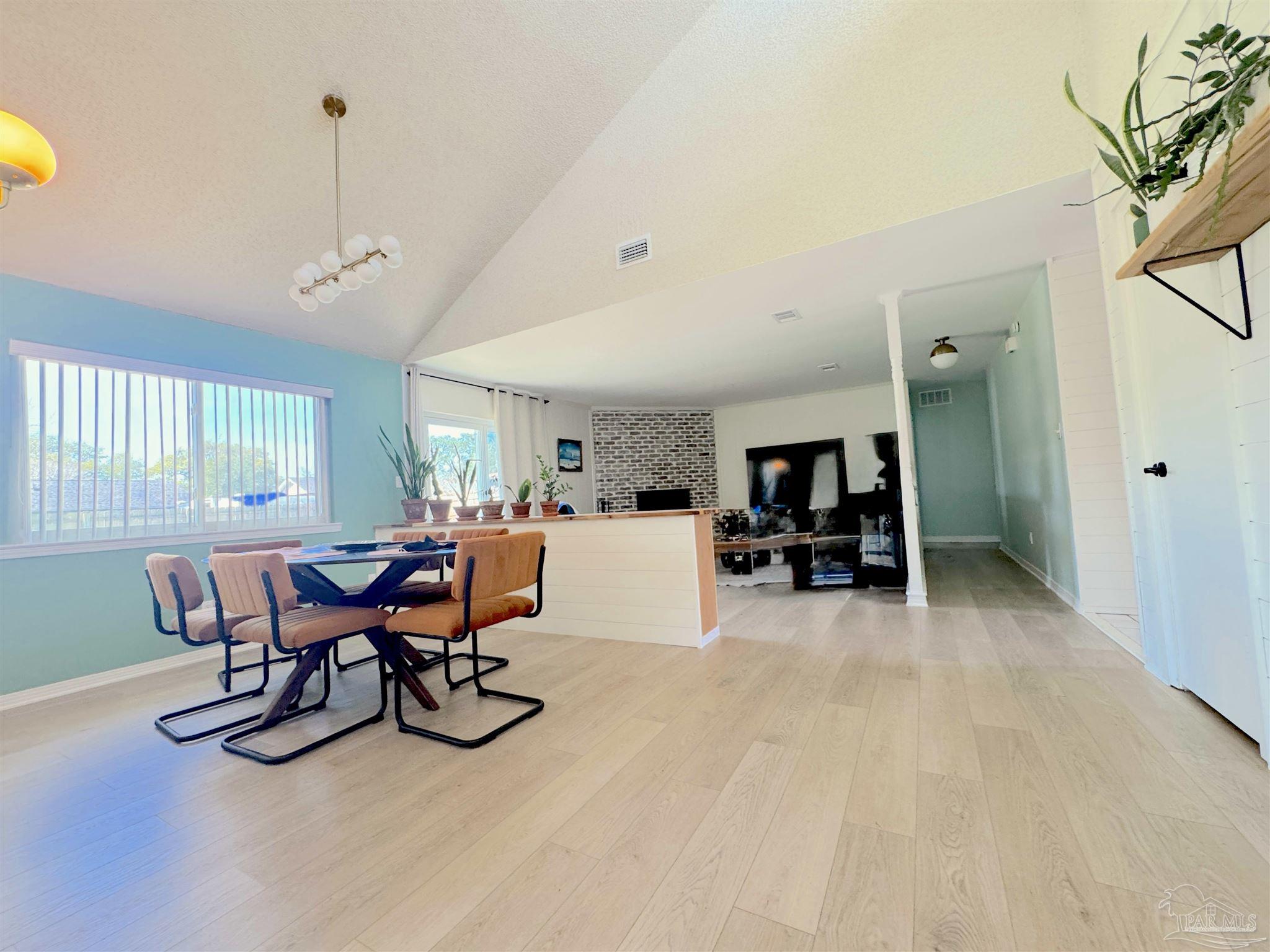 3585 Riddick Drive Pensacola, FL 32504 - Photo 4 of 22 a view of a dining room with furniture and a livingroom