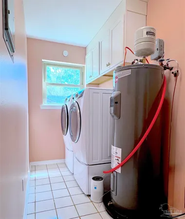 a utility room with washer and dryer