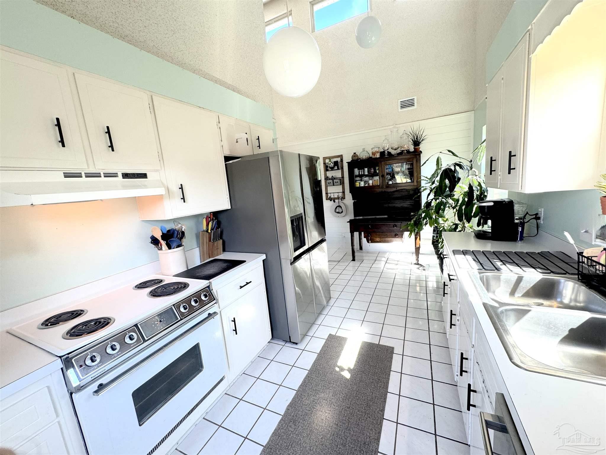 3585 Riddick Drive Pensacola, FL 32504 - Photo 10 of 22 a kitchen with a sink appliances and cabinets
