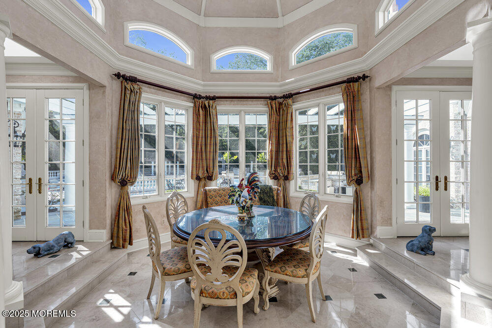 1762 Todd Road Toms River, NJ 08755 - Photo 38 of 69 a dining room with furniture a chandelier and wooden floor