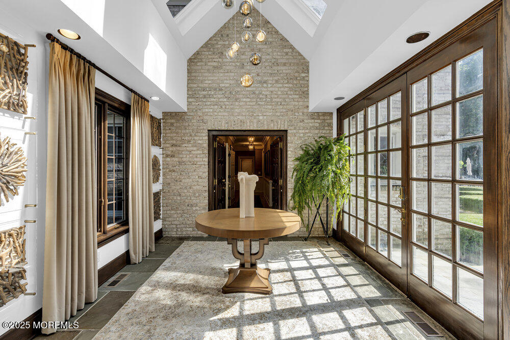 1762 Todd Road Toms River, NJ 08755 - Photo 68 of 69 a front view of a house with a large window and table and chairs