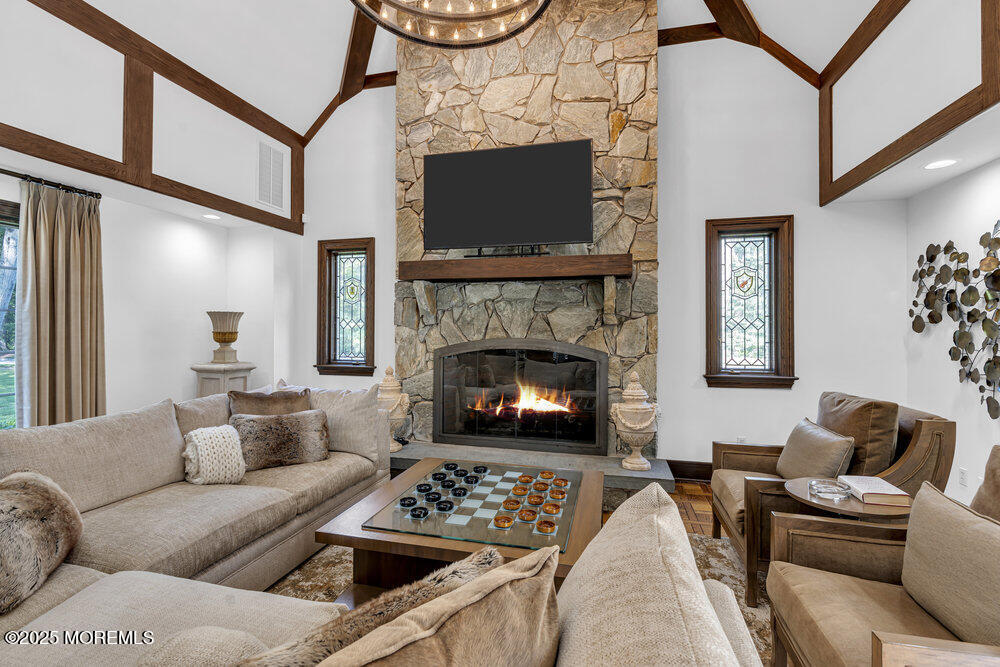 1762 Todd Road Toms River, NJ 08755 - Photo 10 of 69 a living room with furniture a flat screen tv and a fireplace