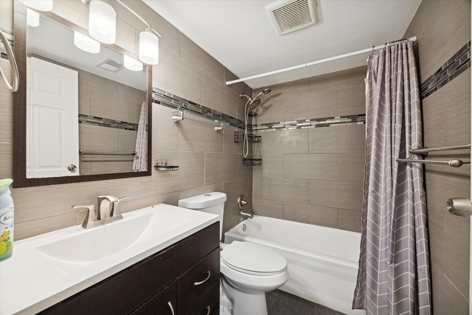 1860 Huntington Boulevard, Unit E Hoffman Estates, IL 60169 - Photo 12 of 16 a bathroom with a sink toilet tub and shower