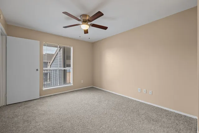 an empty room with fan