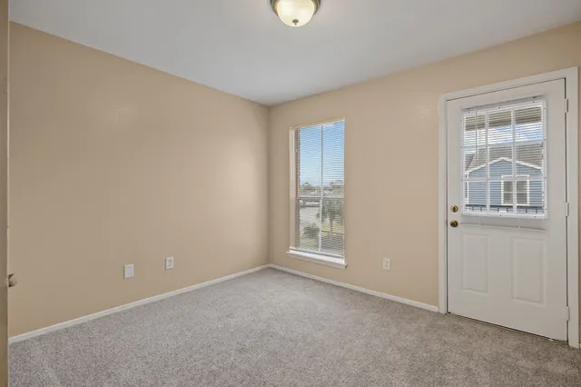 a view of empty room with windows