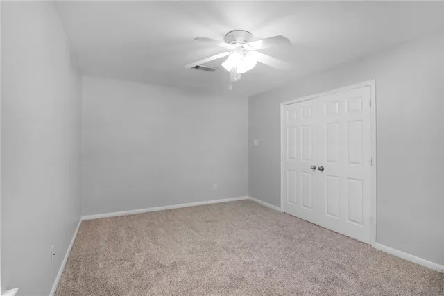 a view of a livingroom with furniture and a kitchen