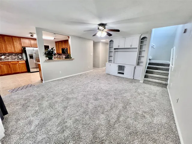 a bathroom with a granite countertop sink a mirror and a bathtub