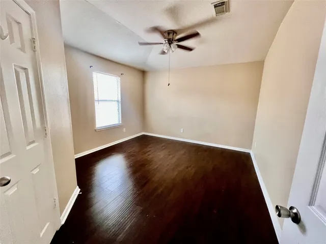 a view of a house with a yard and patio