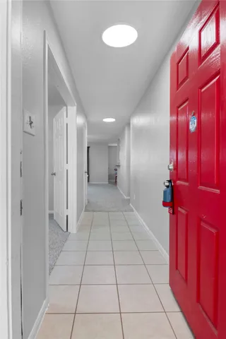 a kitchen with granite countertop stainless steel appliances a refrigerator stove top oven and sink