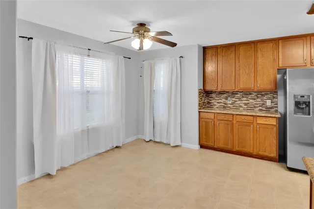 a kitchen with granite countertop a sink and a stove
