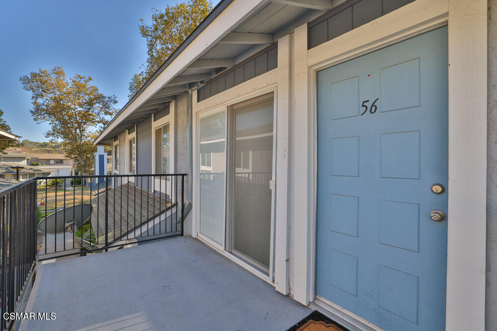 577 Spring Road, Unit 56 Moorpark, CA 93021 - Photo 3 of 19 a view of a house with a wooden bench and a window