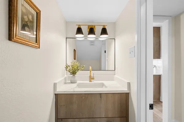 a bathroom with a sink and a mirror