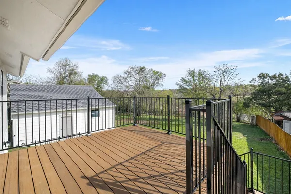 a balcony with trees in front of it