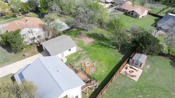 an aerial view of a house with garden space sitting space and swimming pool