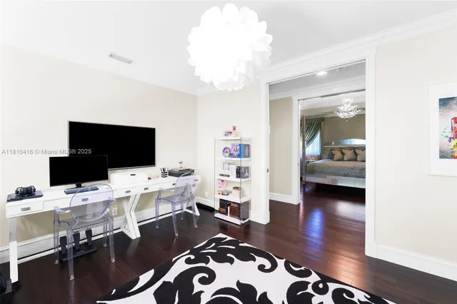 a view of a livingroom with workspace and a couch