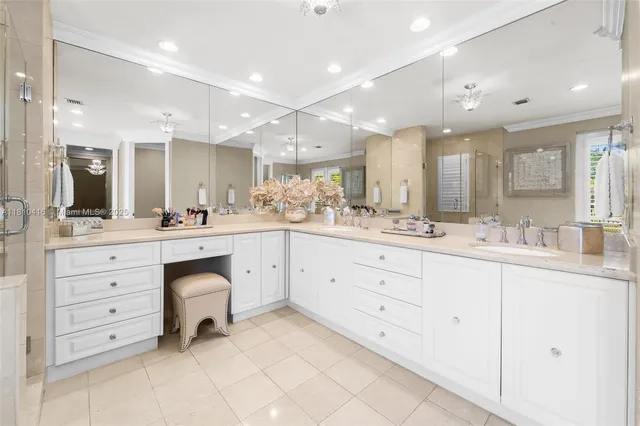 a bathroom with a sink vanity and mirror