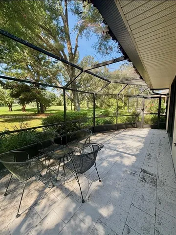 a view of a backyard with sitting area