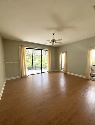 a view of livingroom and hall with wooden floor