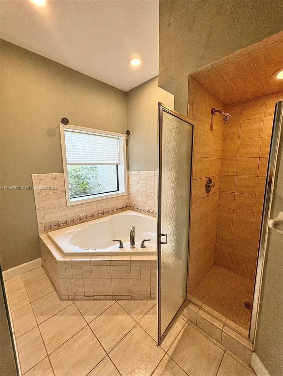 3356 North Bent Tree Point Lecanto, FL 34461 - Photo 19 of 25 a bathroom with a bathtub and a shower