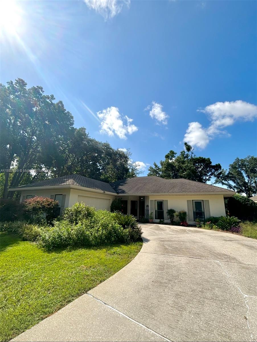 3356 North Bent Tree Point Lecanto, FL 34461 - Photo 2 of 25 front view of a house with a yard