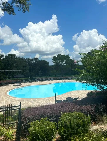 a view of a lake with a yard