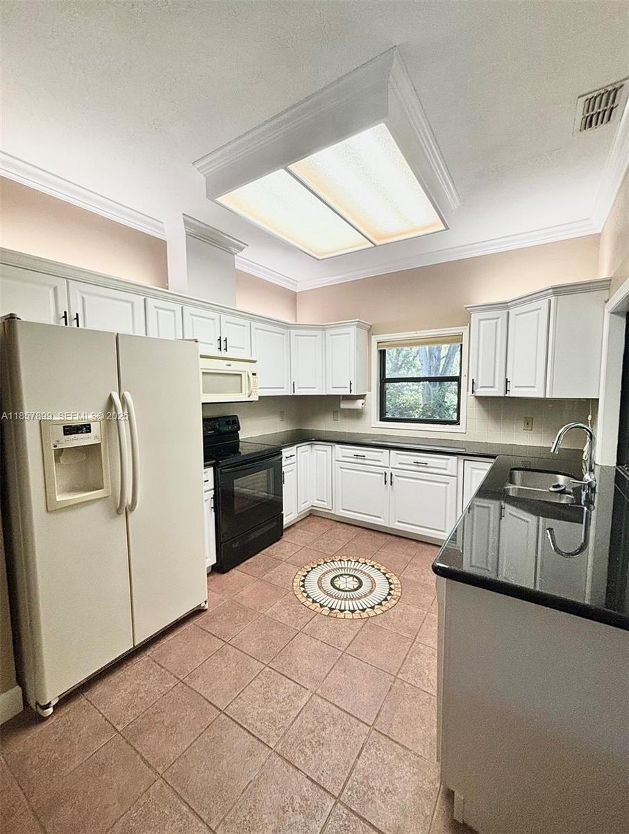 3356 North Bent Tree Point Lecanto, FL 34461 - Photo 4 of 25 a kitchen with stainless steel appliances granite countertop a refrigerator sink and stove