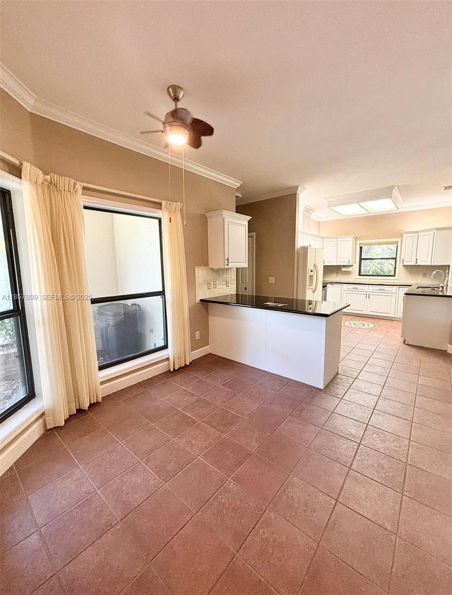 3356 North Bent Tree Point Lecanto, FL 34461 - Photo 6 of 25 a view of a kitchen with a sink and microwave