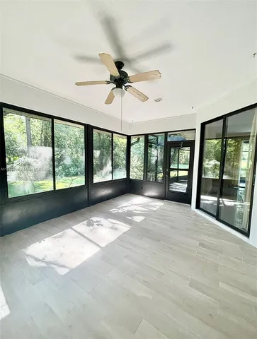a view of an empty room with a balcony