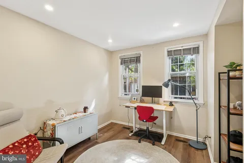 a workspace with furniture and a window