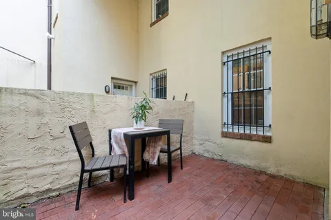 a workspace room with furniture and wooden floor