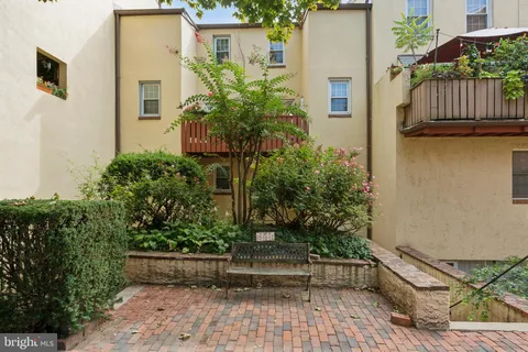 front view of a house with a garden
